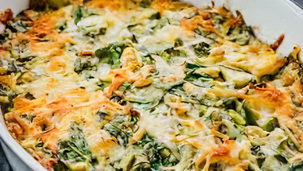 Aprilia's Artichoke and Spinach Dip · Oven baked dip made with artichokes, Mozzarella, Garlic and Parmigiano served with small pieces of bread