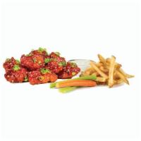 10 Boneless Wing Combo  · 10 boneless wings, choice of 2 flavors, 2 house-made sauces, fries, and carrots and celery.