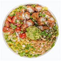 Chicken Chop · Crispy Chicken, tomatoes, roasted corn, avocado mash, pepitas, crispy tortillas, cotija, cil...