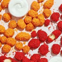 Fried Cheetos® Cheese Bites · Fried cheese tossed in Cheetos® sauce and coated in crunchy Cheetos® crumbles. Served with B...
