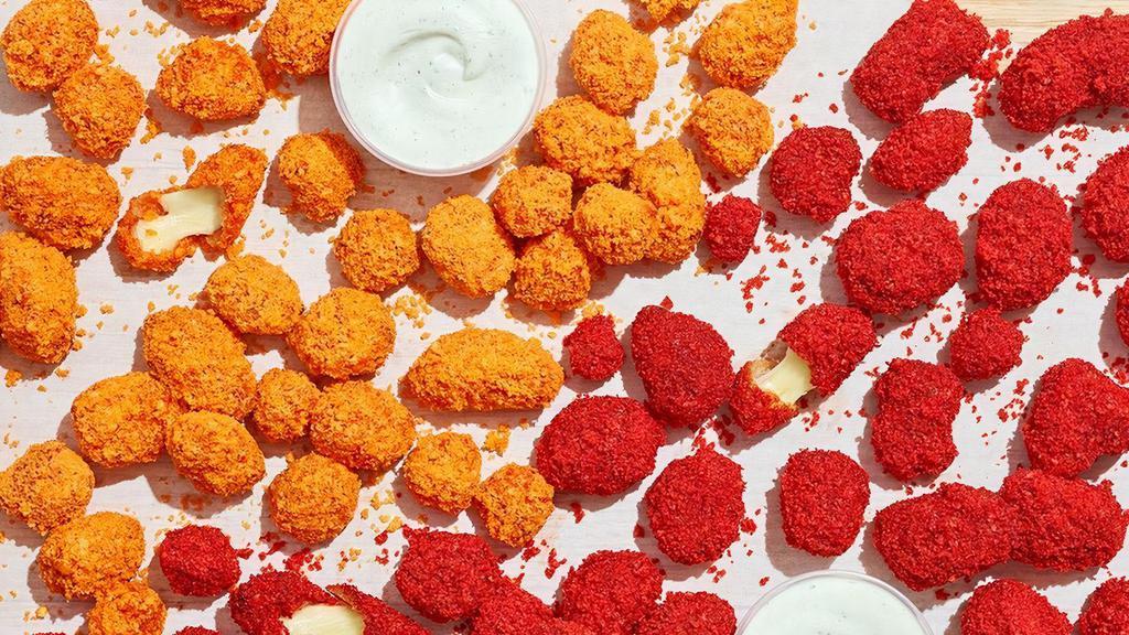 Cheetos® Flamin' Hot® Cheese Bites · Fried cheese tossed in Cheetos® Flamin’ Hot® sauce and coated in crunchy Cheetos® crumbles. Served with Bleu cheese or house-made ranch for dipping.