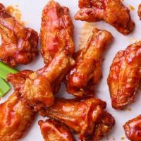 Traditional Wings · Battered and double fried bone-in wings tossed in your choice of sauce. Served with celery a...