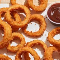 Onion Rings · Crispy golden crunch onion rings with Honey BBQ dipping sauce.