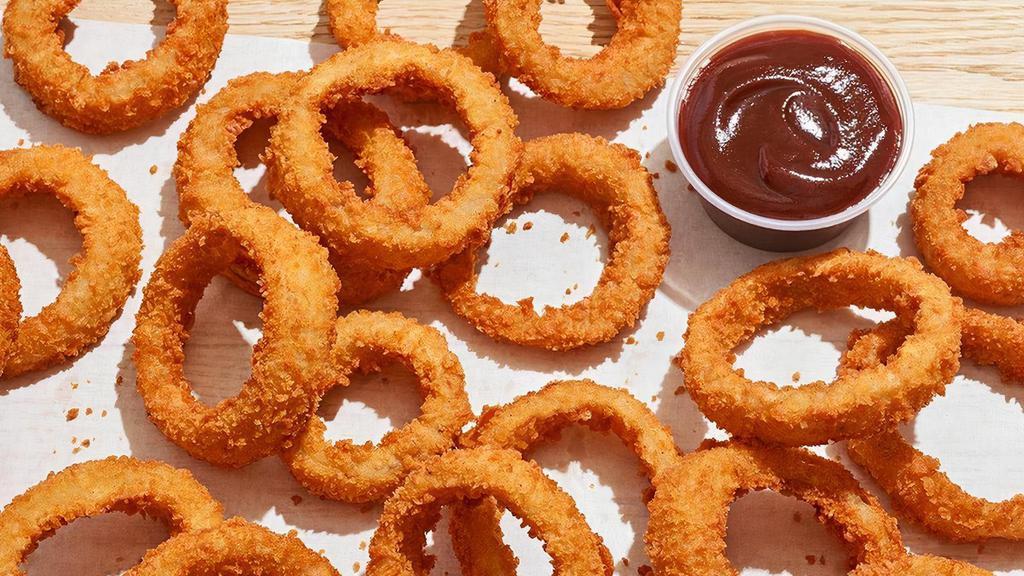 Onion Rings · Crispy golden crunch onion rings with Honey BBQ dipping sauce.