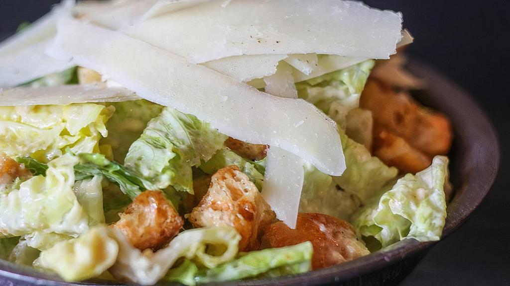 Caesar Salad · Romaine Lettuce, Parmesan Cheese, House Caesar Dressing, Croutons. (Dressing and Croutons served on the side)