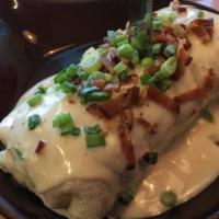 Chicken Fried Steak Burrito · Chicken fried steak, hash browns, scrambled eggs, wrapped in a flour tortilla and topped wit...