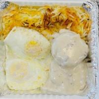 Country Breakfast · Warm biscuits smothered with country sausage gravy, served with hash browns, and two eggs, a...