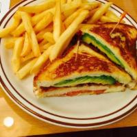 Redwood Club · Grilled breast of chicken with crisp bacon, avocado, tomato, and melted Swiss cheese on gril...