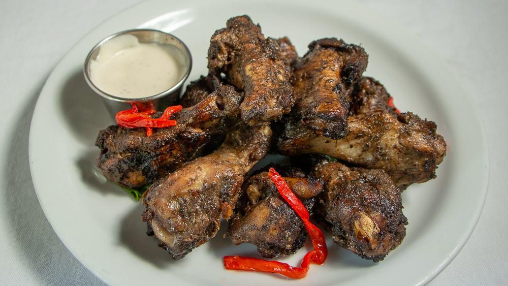 Jerk Grilled Chicken Wings · 10-piece grilled to perfection rubbed in jerk seasoning, ranch dressing