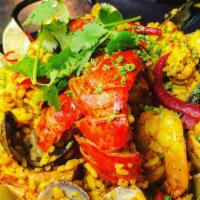 Paella Valenciana | Seafood Paella · saffron bomba rice, 4 oz. lobster tail, shrimp, mussels, clams, Spanish chorizo, Gluten-free