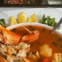 Caldo de Pescado · Fish stew, carrot, pumpkin, corn, potatoes, and cilantro, served with rice, and 3 hand made ...