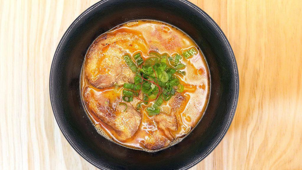 Spicy Miso Ramen · Pork Base Broth, Pork Chashu, House Made Miso Paste, Chili Oil, Green Onion.