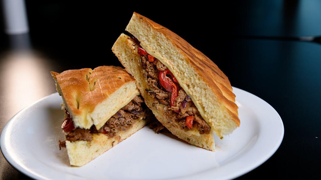 Steak Panini Sandwich · Steak, red peppers, red onions, pepper jack cheese, and BBQ buttermilk.