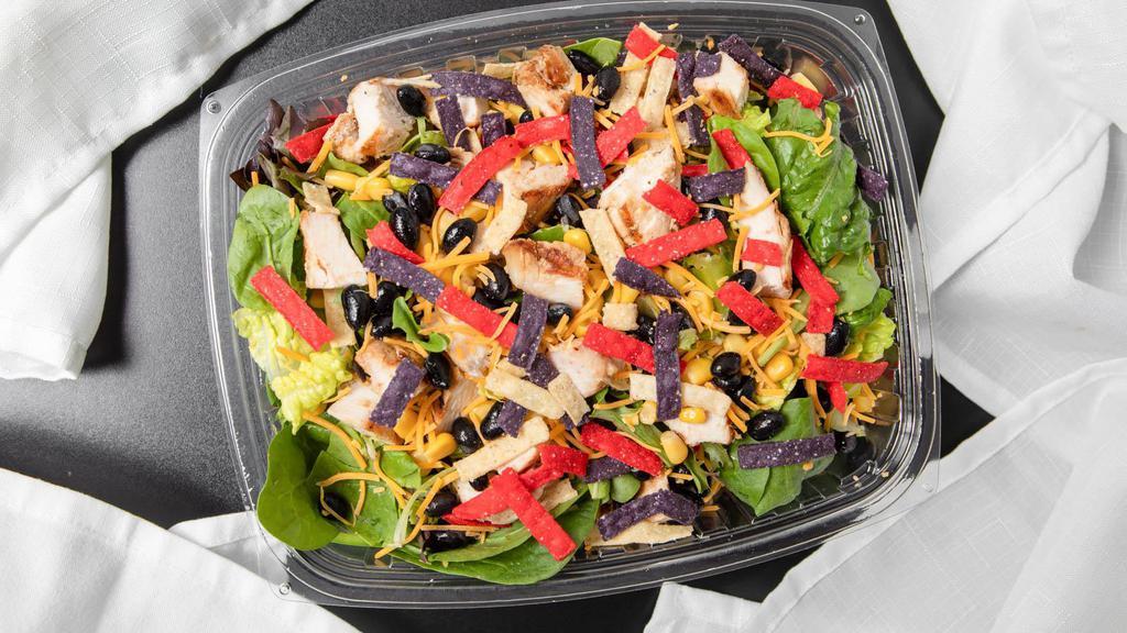 Southwest Chicken Salad · Grilled chicken, corn, black beans, cheddar cheese, romaine, mixed greens, southwest dressing, tortilla strips.