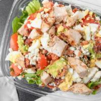 Chicken Cobb Salad · Avocado, grilled chicken, smoked bacon, eggs, tomatoes, blue cheese, greens, buttermilk-herb...