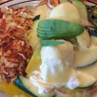 Veggie Benedict · English Muffin Topped With Sautéed Veggies, Avocado, Two Poached Eggs, And Hollandaise Sauce.