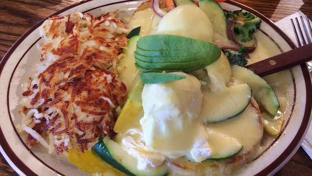 Veggie Benedict · English Muffin Topped With Sautéed Veggies, Avocado, Two Poached Eggs, And Hollandaise Sauce.
