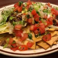 Grande Nachos · Chicken, Beef, or Pulled Pork Served On A Bed Of Crispy Tortilla Chips Topped With Cheese, B...