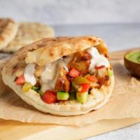 Pita Chicken · Hummus, chicken, cucumber, tomato, pickles, and tahini(gf)