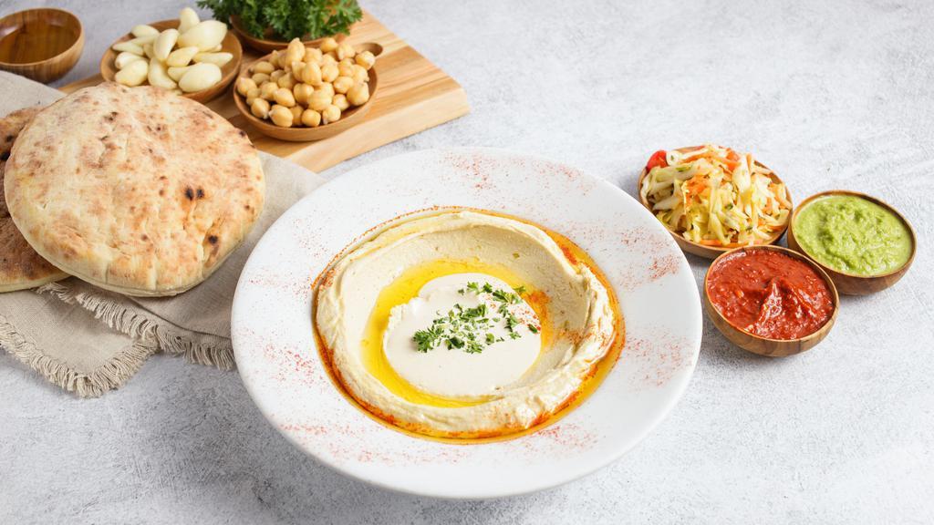 Hummus Classic · Hummus with imported tahini, olive oil, and our secret sauce (gf, v)