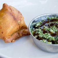 Samosa (1) · A single crunchy savory pastry stuffed with spicy potatoes and peas. Served with zingy cilan...