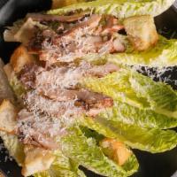 Grilled Chicken Caesar Salad · Grilled chicken served on a hearty Caesar salad with house made dressing and croutons.