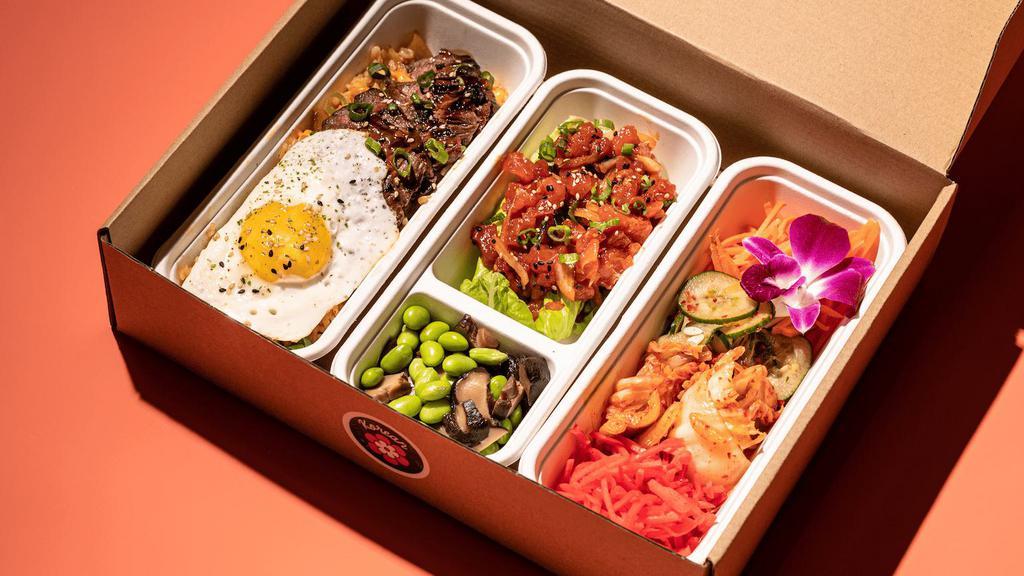 Pacific Boxes | Korean · grilled skirt steak, kimchi fried rice, sunny-side egg, Korean ahi poke, wonton chips, spicy cucumber banchan, kimchi, glazed shiitake mushrooms, edamame, pickled red ginger, pickled carrots