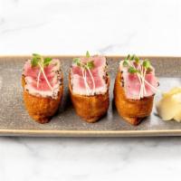 Ahi Tataki Bombs · sesame-crusted ahi tuna, inari sweet-soy pocket, seasoned sushi rice, ponzu 