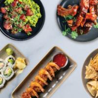 Shareables Sampler | Family Style · A variety of guests favorites for the family to share: one Guaca-Poke, one Baja Shrimp Cevic...