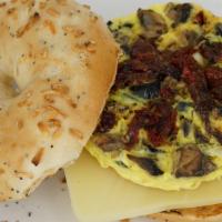 19. Mediterranean Omelet · Egg, mushroom, sun-dried tomatoes, olive, Swiss cheese, salt, and pepper.