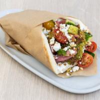Falafel Sandwich · House Falafel, Made To Order.
Garlic yogurt, tahini, Persian cucumber, tomato, pickled red o...