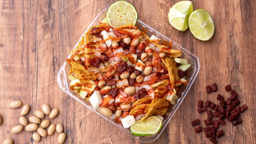 Tostilocos · Mexican Spicy desert with your choice of chips, fruits, and more.