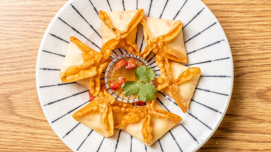 Crab Rangoon · imitation crab meat cream, cheese.onion, fried in wonton wrapper, house made sweet & sour sauce.