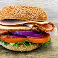 Turkey Breast Sandwich · Bagel with cold cut turkey breast. Comes with mayo, mustard, lettuce, tomato, onion, cucumbe...
