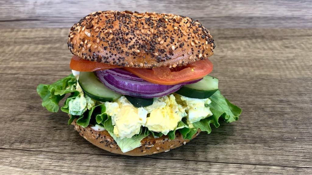 Egg Salad Bagel · Egg Salad with mayo, lettuce, pickles, tomatoes, peppers, onions, sprouts and cucumbers