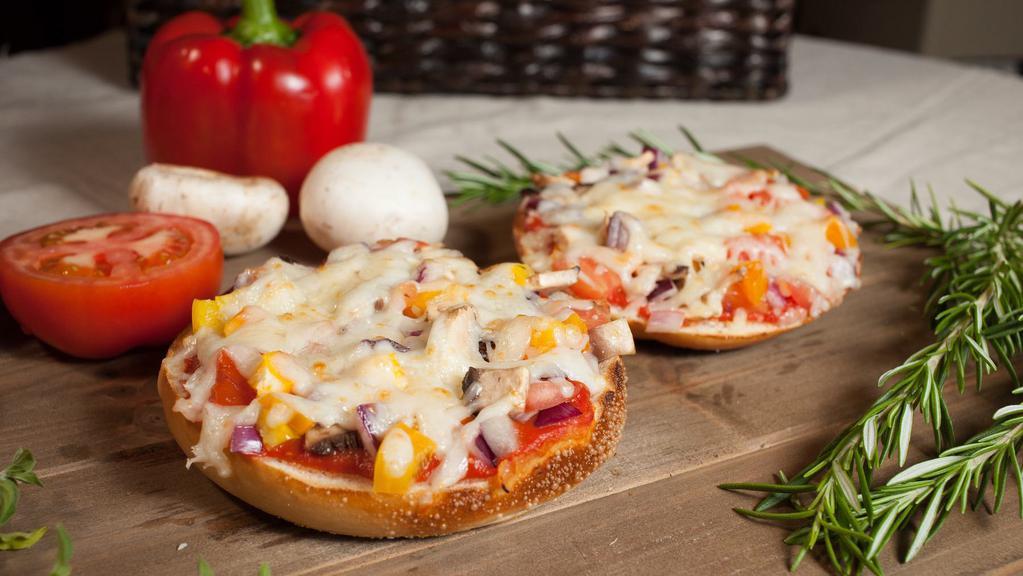 Pizza Supreme · Marinara sauce, Mozzarella cheese, mix of bell peppers, onions, tomatoes, and mushroom.