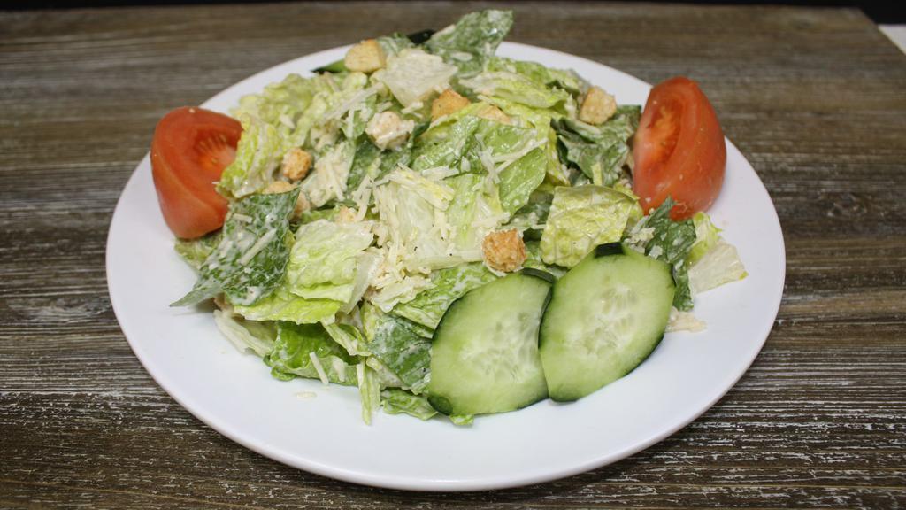 Caesar Salad · Romaine lettuce, crouton, parmesan cheese, cucumber and tomato mix with caesar dressing.