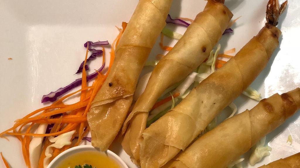 Fried Shrimp Rolls · Marinated with Thai herbs. Served with pineapple sauce.
- Need extra sauce? Check our 