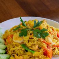 Pineapple Fried Rice · Fried rice of Shrimps and Chicken (or your choice), pineapple, raisin, cashew, egg, tomato, ...