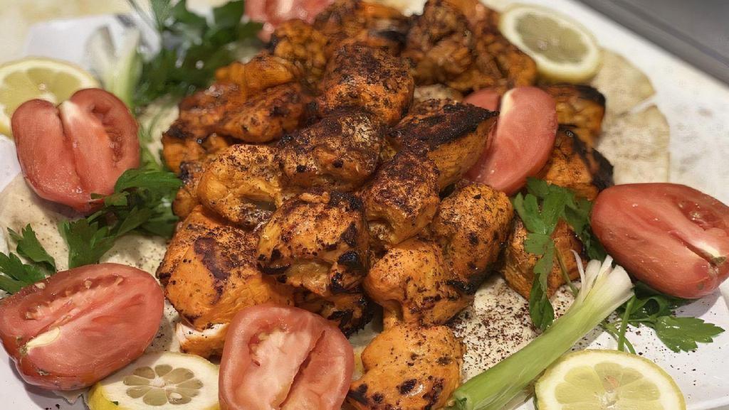 Chicken Kabab · Served with rice, salad, hummus, and pita.
