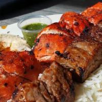 Combination Kabab · Choice of two meat, chabli and beef or chicken and lamb. Served with rice, salad, hummus, an...