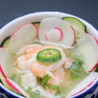 Aguachile de camaron · Gluten-free. Serrano chili, ginger, celery, lime juice, jicama cucumber, radish, avocado, sh...