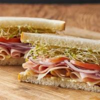 REO Speedwagon · Smoked ham, turkey breast and Monterey jack cheese with onions, tomato, clover sprouts and E...