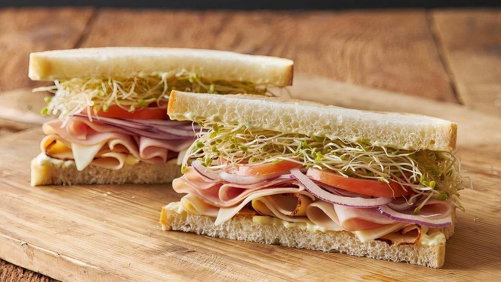 REO Speedwagon · Smoked ham, turkey breast and Monterey jack cheese with onions, tomato, clover sprouts and Erik’s Secret Goo on fresh baked sourdough.. 650 Cal