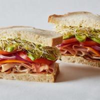 Dub Club · Slices of turkey breast topped with smoked ham, bacon, avocado, cheddar cheese, with Erik’s ...