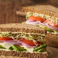 Del Monte Special · Hearty 9-grain bread with avocado, Monterey jack cheese, onions, tomato, clover sprouts and ...