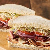 Pot Belly · Slices of turkey breast topped with pastrami, Monterey jack cheese, onions, tomato, clover s...