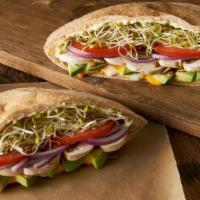 Natural High · A warm sandwich with a wheat pita stuffed with Monterey jack and cheddar cheese, avocado, mu...