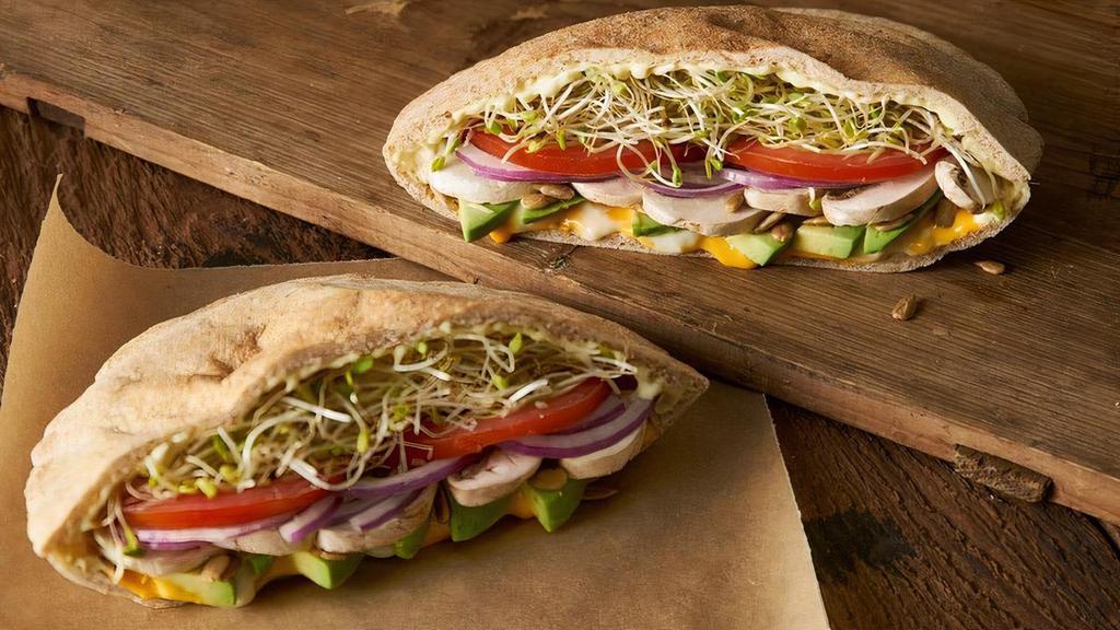 Natural High · A warm sandwich with a wheat pita stuffed with Monterey jack and cheddar cheese, avocado, mushrooms, sunflower seeds, onions, tomato, clover sprouts and Erik’s Secret Goo.. 880 Cal