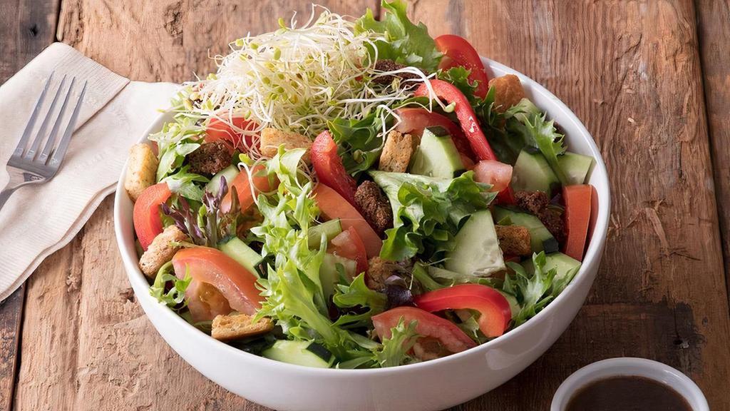 Large House Salad · Garden salad mix with tomato, cucumber, red bell pepper, clover sprouts, and topped with fresh baked croutons.  Served with your choice of dressing. . 200 Cal